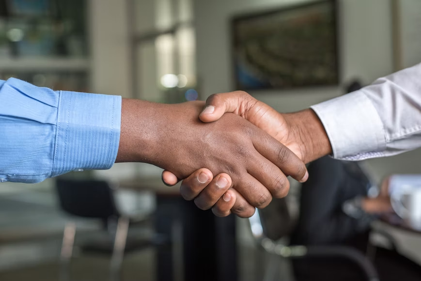 Shakehand with business growth consultant dealing Agreement . 